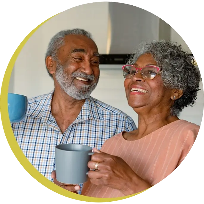 middle age man and woman drinking coffee, smiling