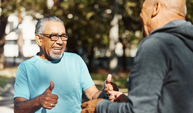 senior men exercising, smiling
